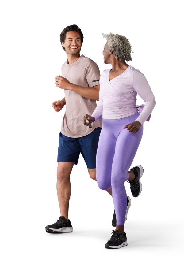A man and woman running next to each other