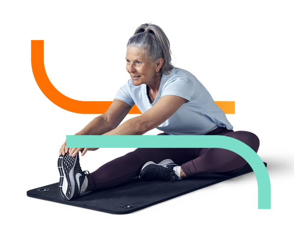 older lady stretching on fitness matt
