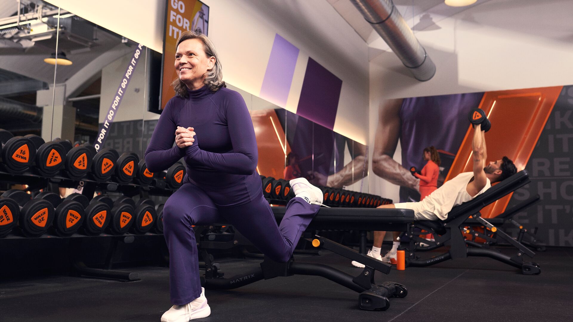Runner doing strength training exercises in the gym